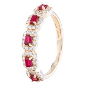 Gold ring with red and white gemstones