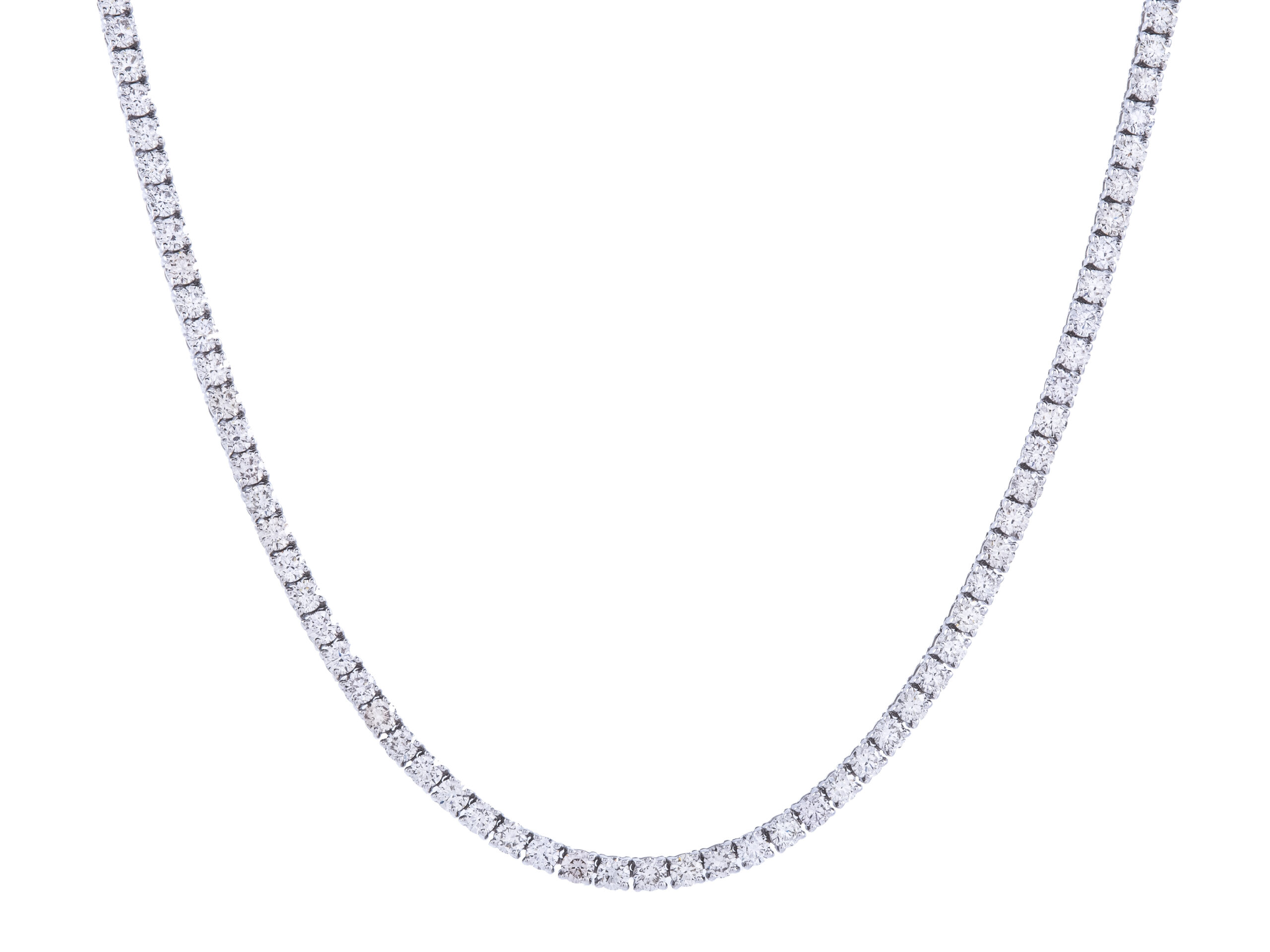 Diamond tennis necklace on white background.