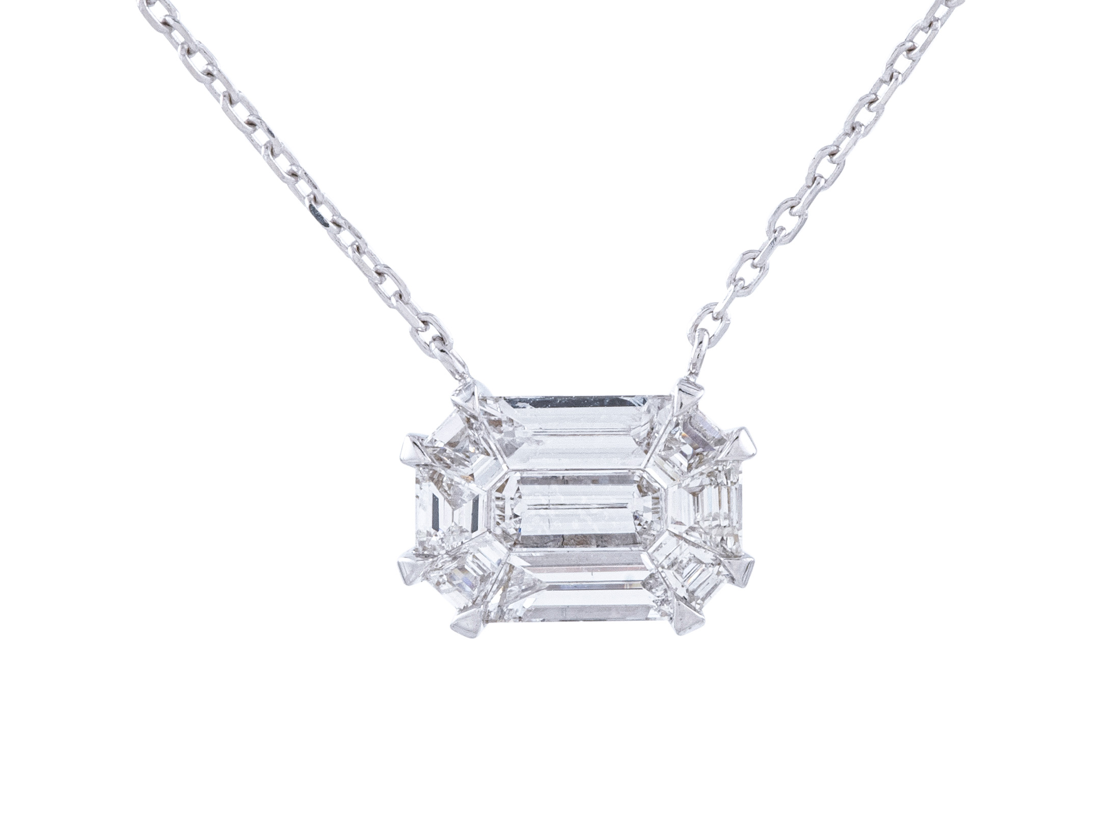 Emerald-cut diamond necklace on a chain.
