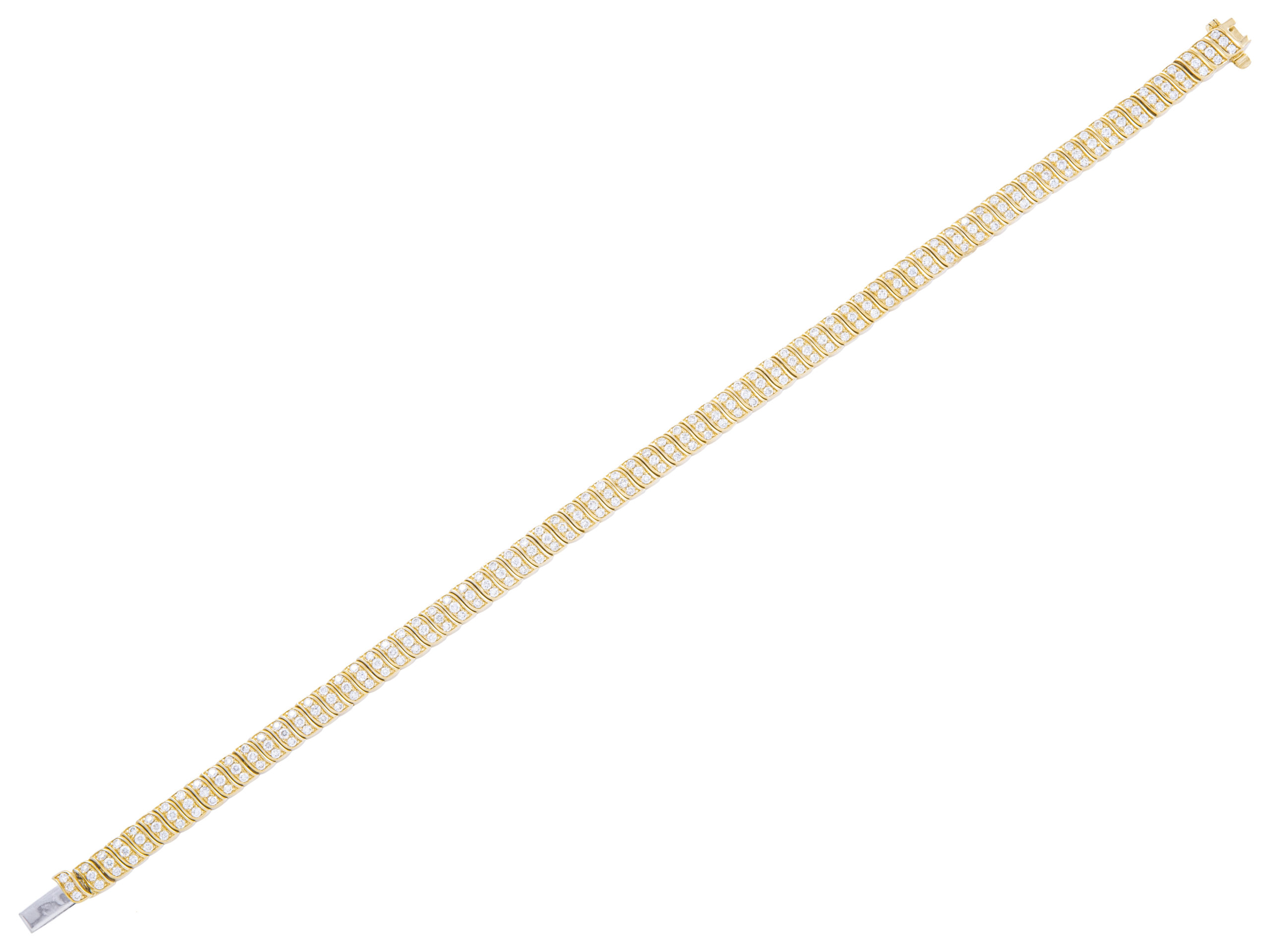 Gold tennis bracelet with diamonds on white background.