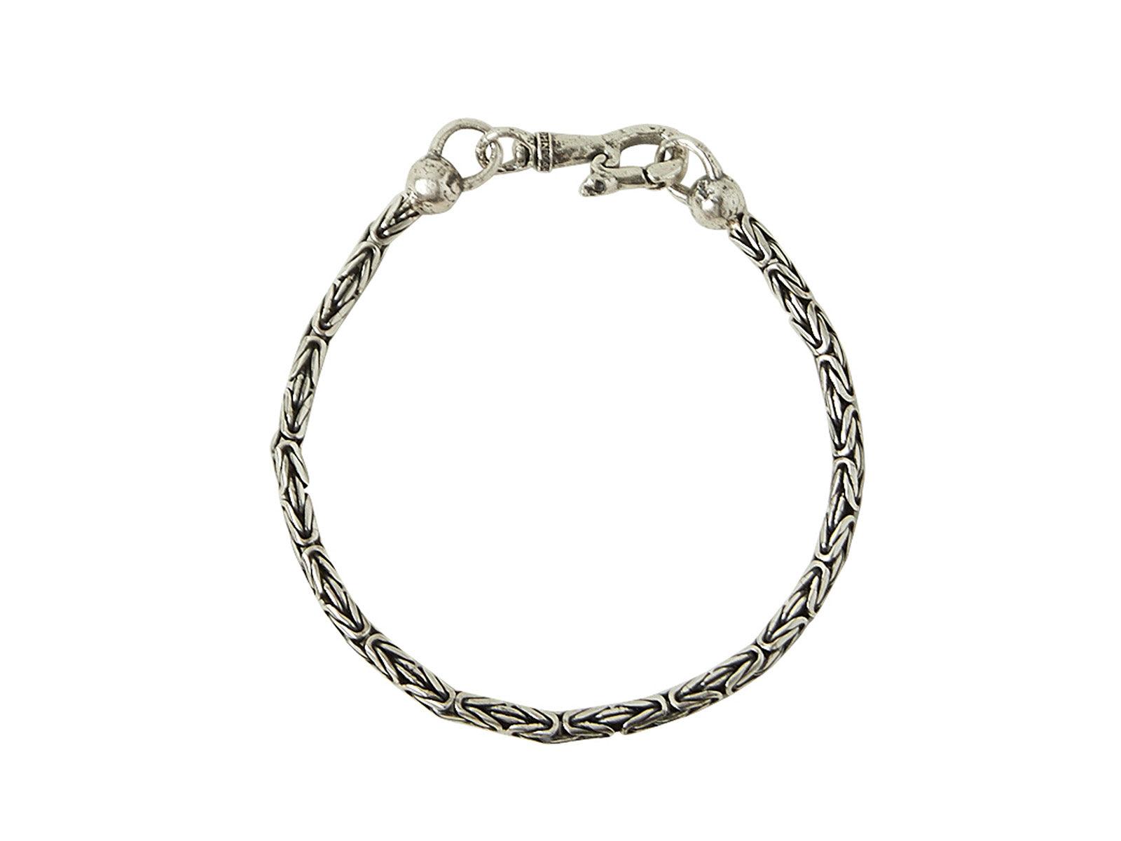 Intricate silver chain bracelet with clasp.