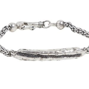 Textured silver bracelet on white background.