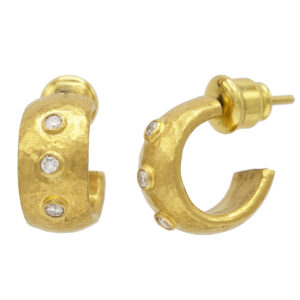 Gold earrings with diamonds, elegant jewelry design.