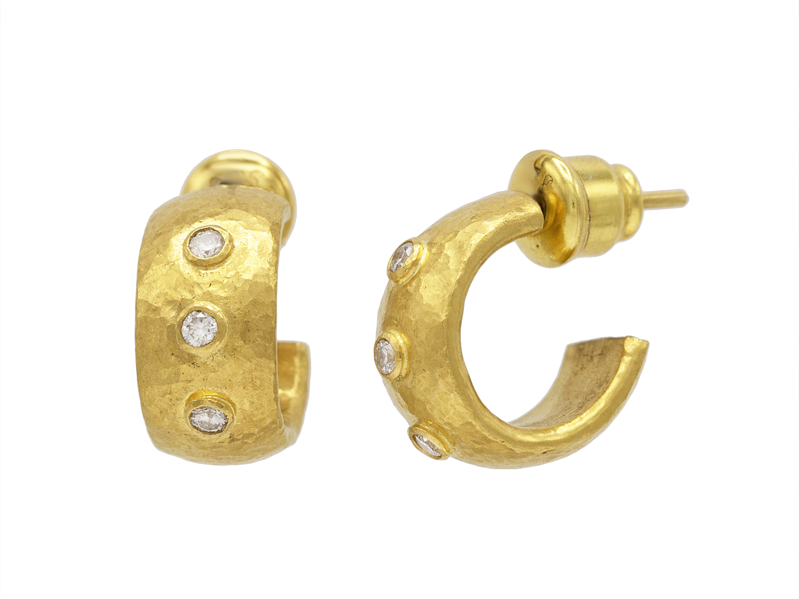 Gold earrings with diamonds, elegant jewelry design.