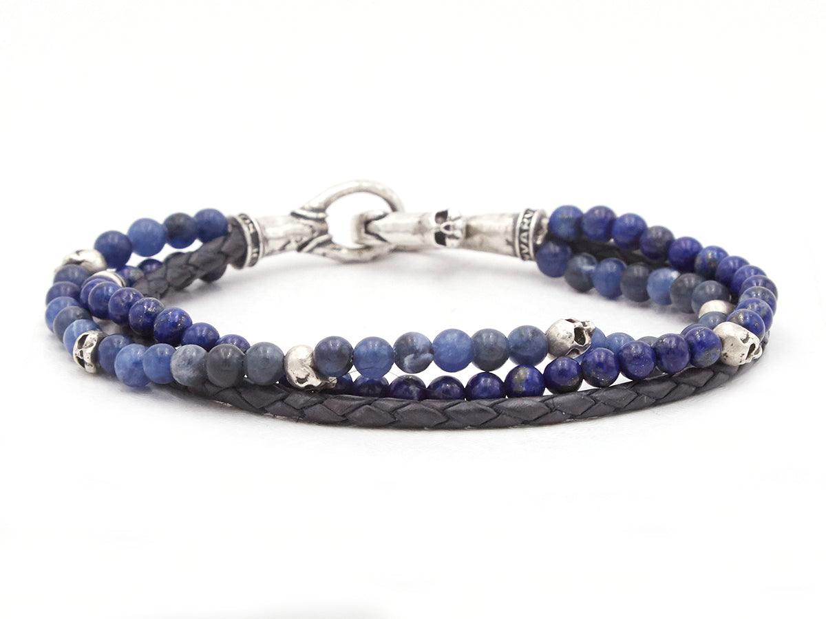 Blue bead and leather bracelet with skull details.