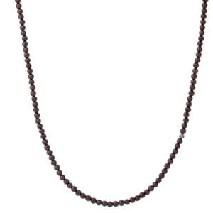 Dark beaded necklace on white background