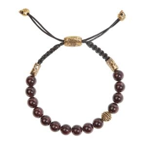 Black and gold beaded bracelet with cord.