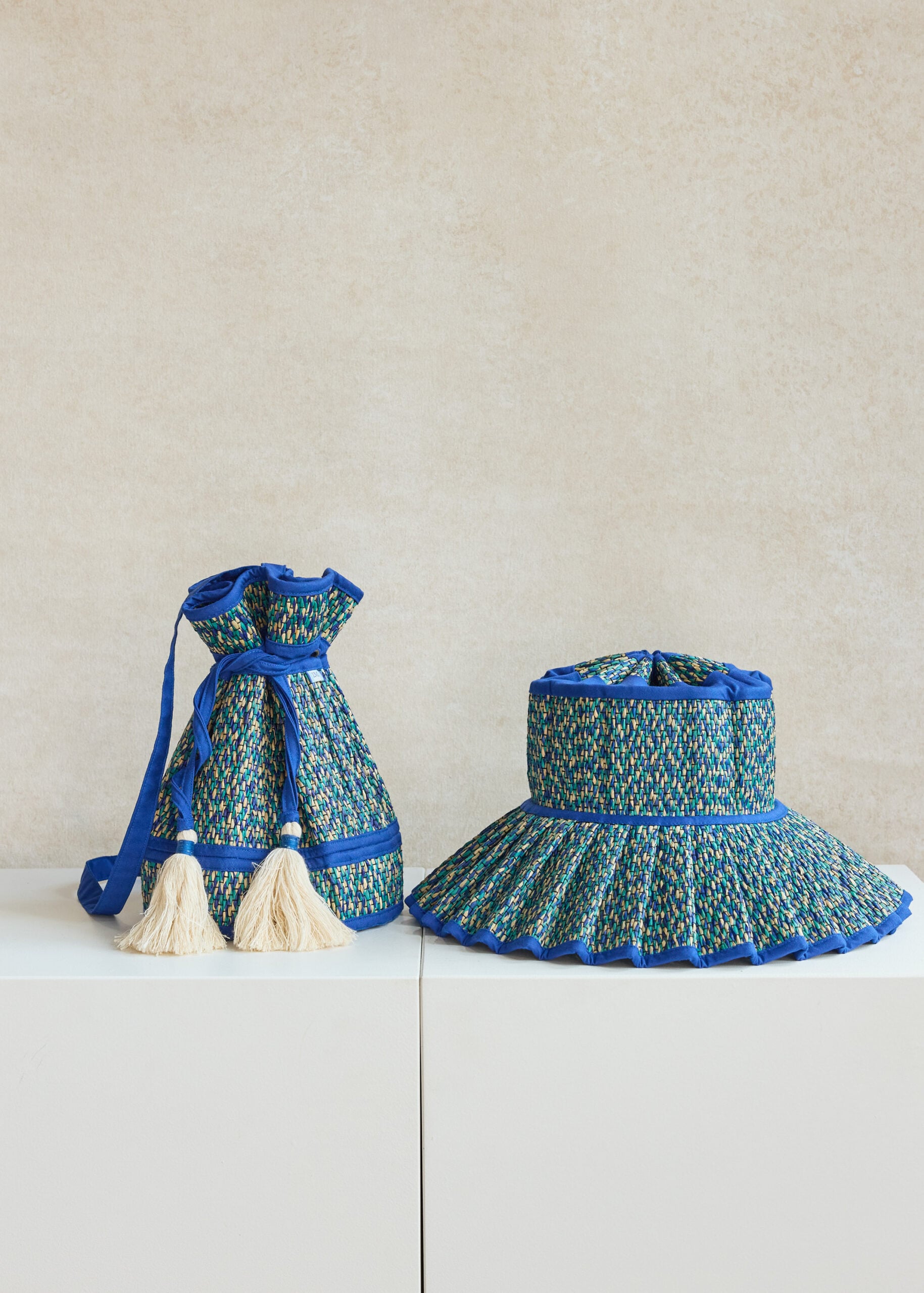 Colorful woven bag and matching hat on display.