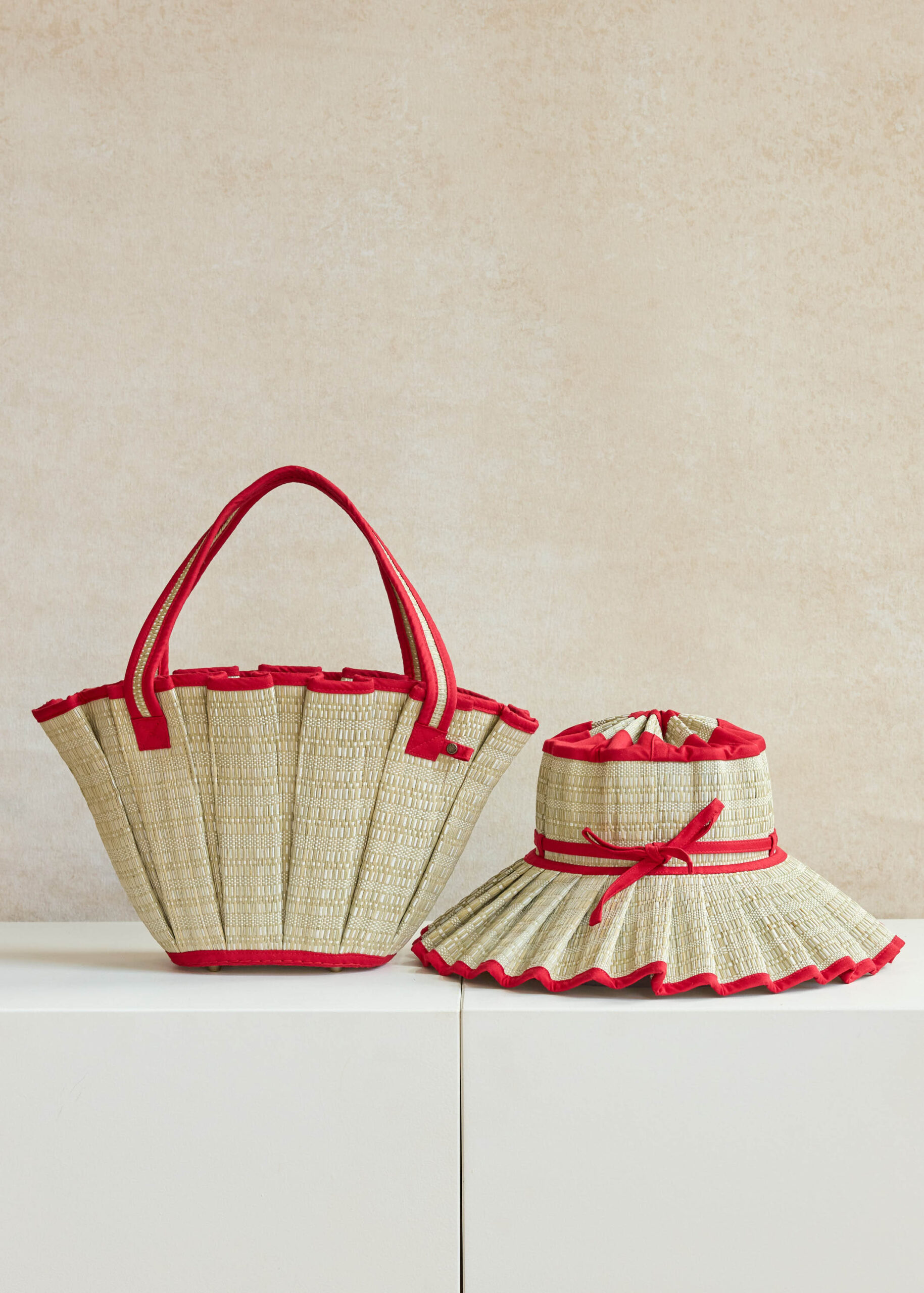 Straw bag and hat with red trim