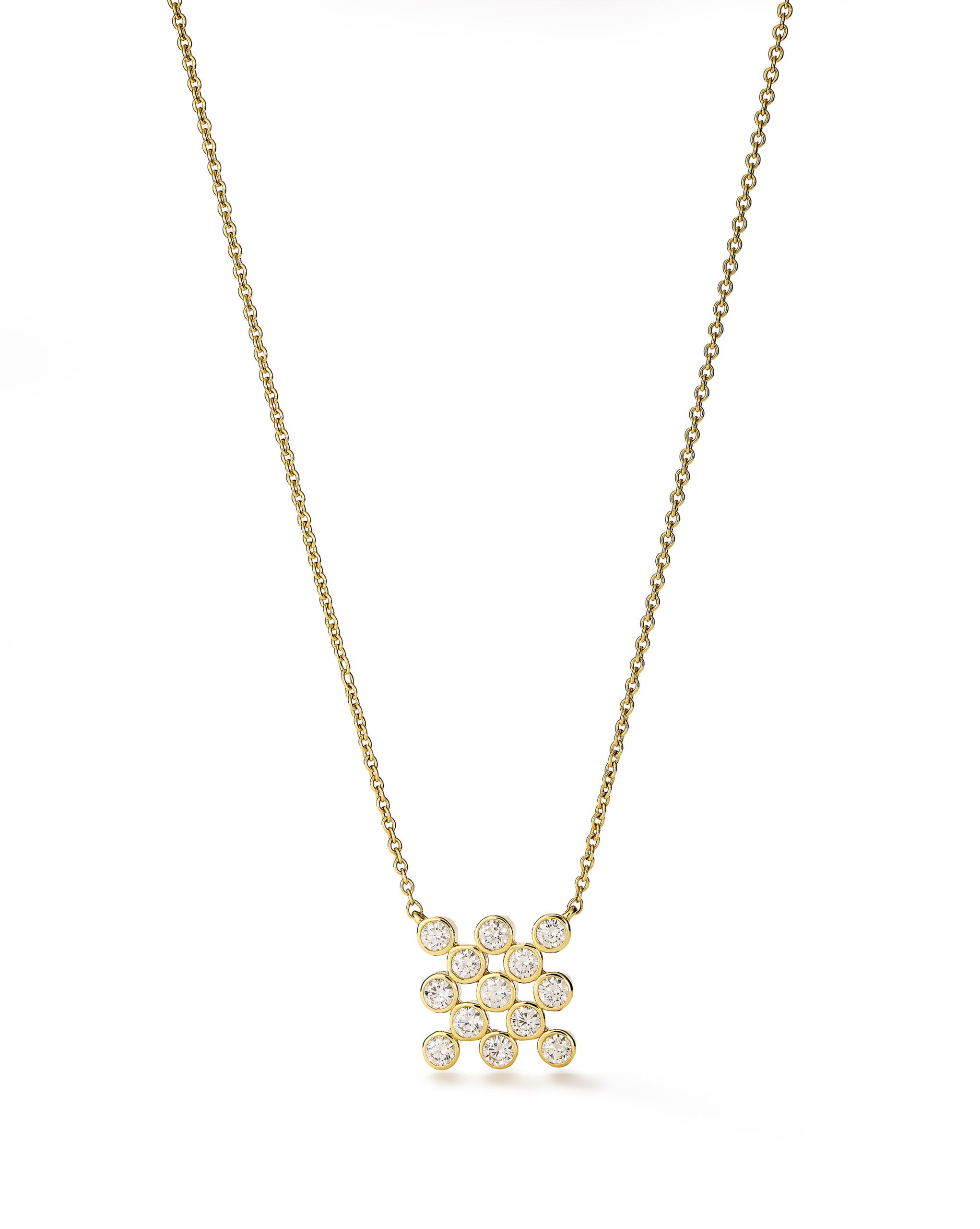 Gold necklace with diamond cluster pendant.